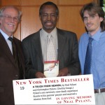 Neal Pylant, Christopher Pylant and Dr Ben Carson with the New York Times Bestselling E-book A Touch from Heaven