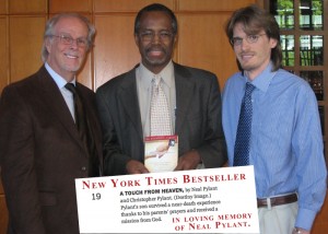 Neal Pylant, Christopher Pylant and Dr Ben Carson with the New York Times Bestselling E-book A Touch from Heaven